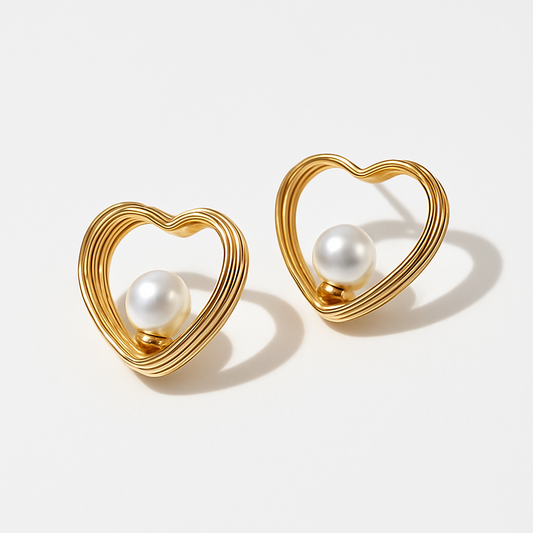 This is a gold heart-shaped earring with a pearl centerpiece. I’ll create a luxury-style product description for your store: